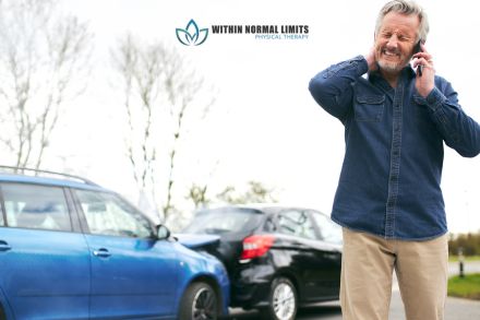 An older man stands near two cars after a collision, holding his neck in pain and talking on his phone. The logo "Within Normal Limits Physical Therapy" is visible above him.